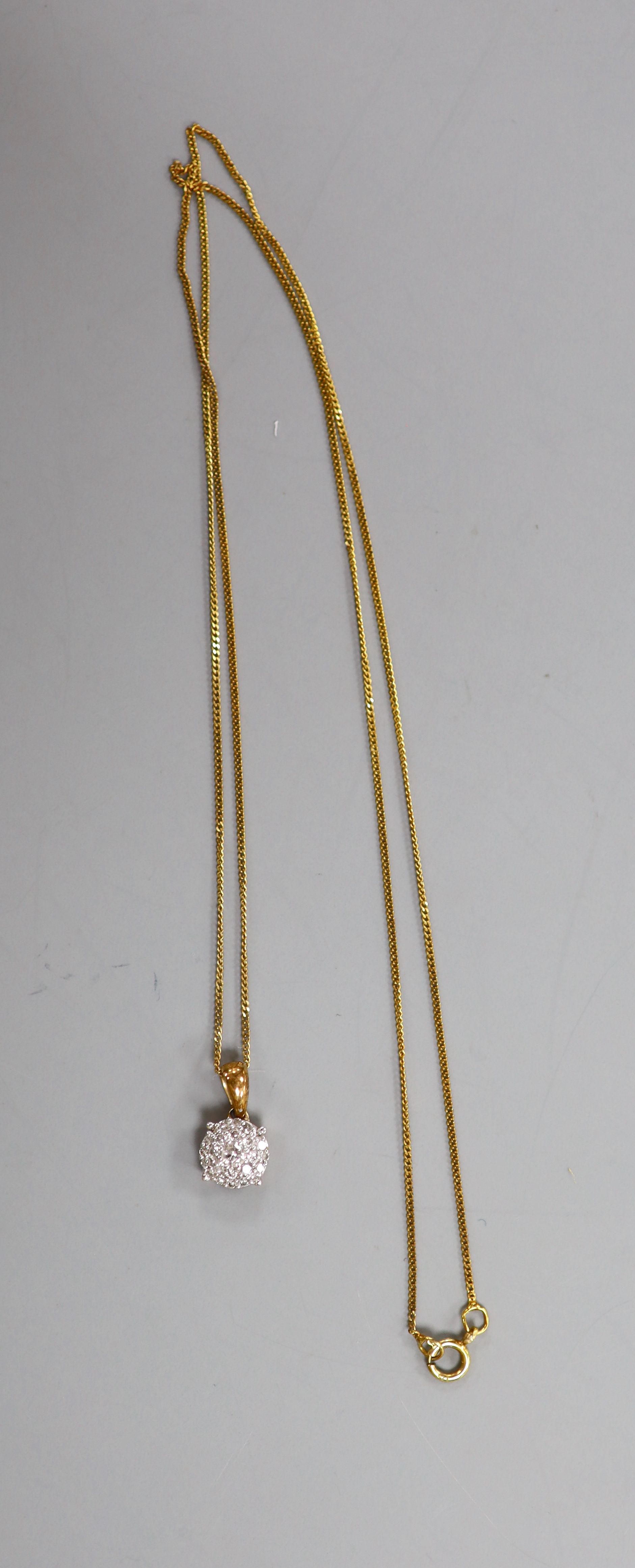 An illusion-set diamond pendant on 9ct gold fine chain and a matching pair of earrings